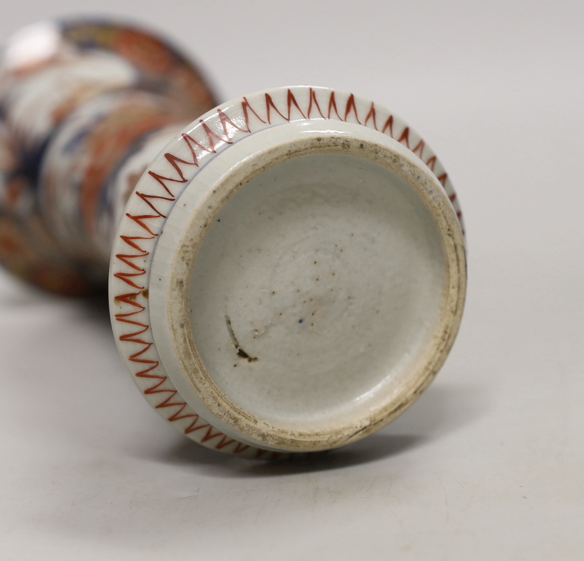 Three 18th century Chinese blue and white plates and an Imari flared vase, 22cm